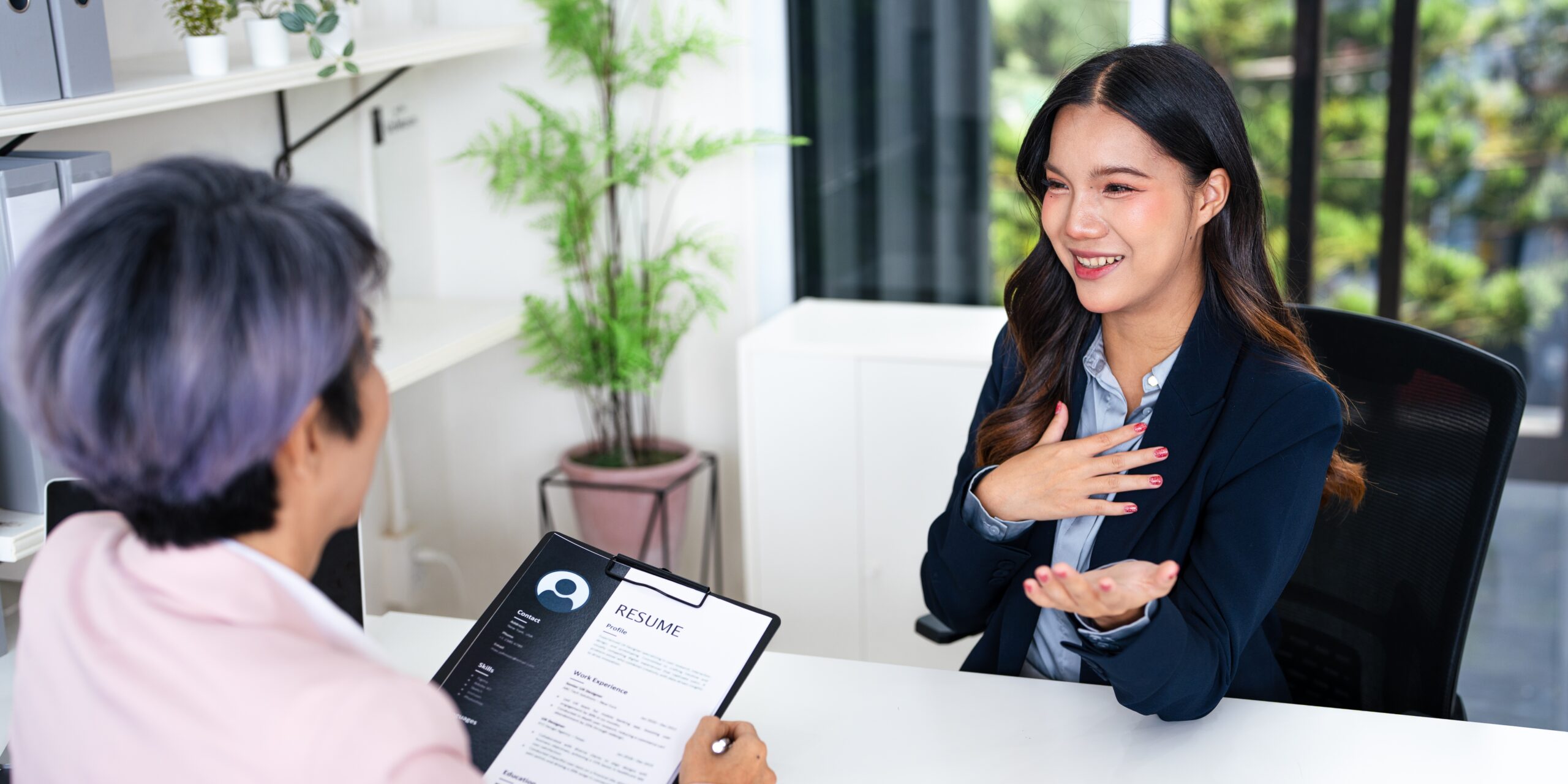 Female applicant explaining in a job interview.