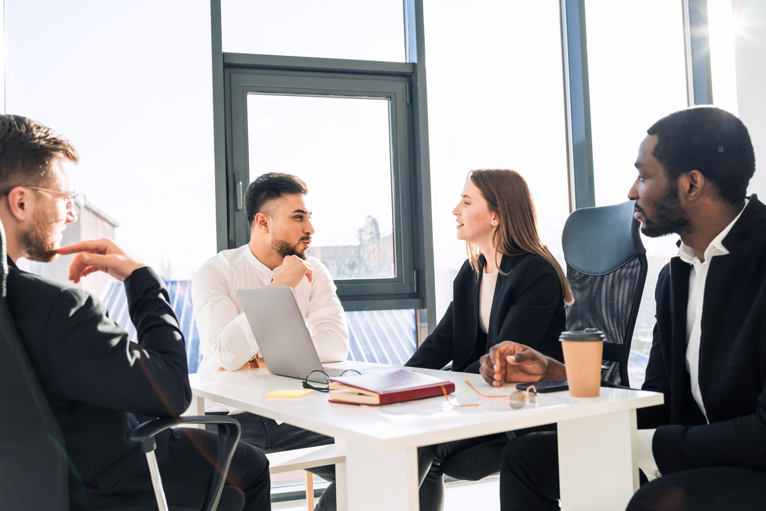 Leaders discussing opportunities for growth in the company.